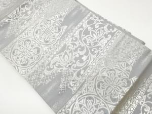 変わり横段に華紋・花唐草・菱模様織出し名古屋帯